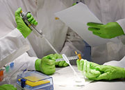 Caption: detail of working in the lab with pipettes